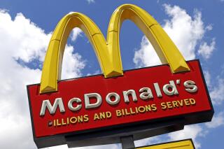 FILE - This June 25, 2019, photo shows the sign outside a McDonald's restaurant in Pittsburgh.  McDonald’s is expanding U.S. testing of its meatless McPlant burger. The company said the McPlant __ which it's developing with plant-based protein company Beyond Meat __ will be tested at 600 stores in the San Francisco and Dallas areas starting Feb. 14, 2022.   (AP Photo/Gene J. Puskar, File)