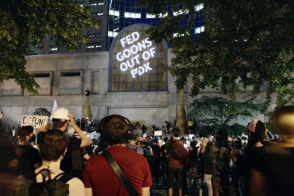 Protesters projected these words on the front of the Multnomah County Justice Center, Monday, July 20, 2020 in Portland, Ore (AP Photo/Gillian Flaccus)