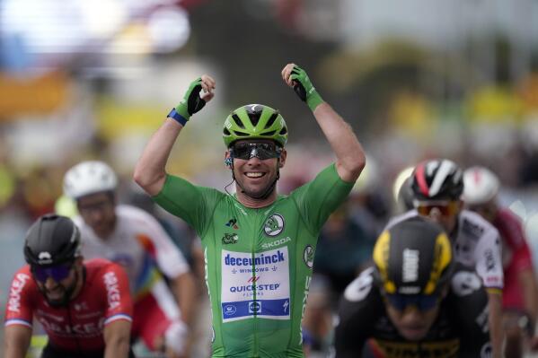 Britain's Mark Cavendish, wearing the best sprinter's green jersey, celebrates as he crosses the finish line to win the tenth stage of the Tour de France cycling race over 190.7 kilometers (118.5 miles) with start in Albertville and finish in Valence, France, Tuesday, July 6, 2021. (AP Photo/Daniel Cole)