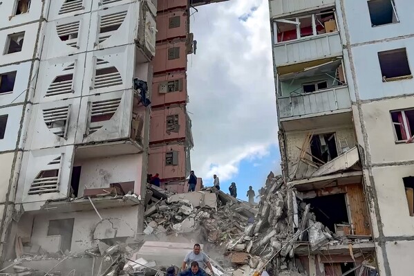 In this photo taken from video released by Belgorod regional governor Vyacheslav Gladkov’s Telegram channel on Sunday, May 12, 2024, Russian emergency services work at the scene of a partially collapsed block of flats authorities said was hit during an attack by Ukrainian shelling, in Belgorod, Russia. (Belgorod Region Governor Vyacheslav Gladkov Telegram channel via AP)