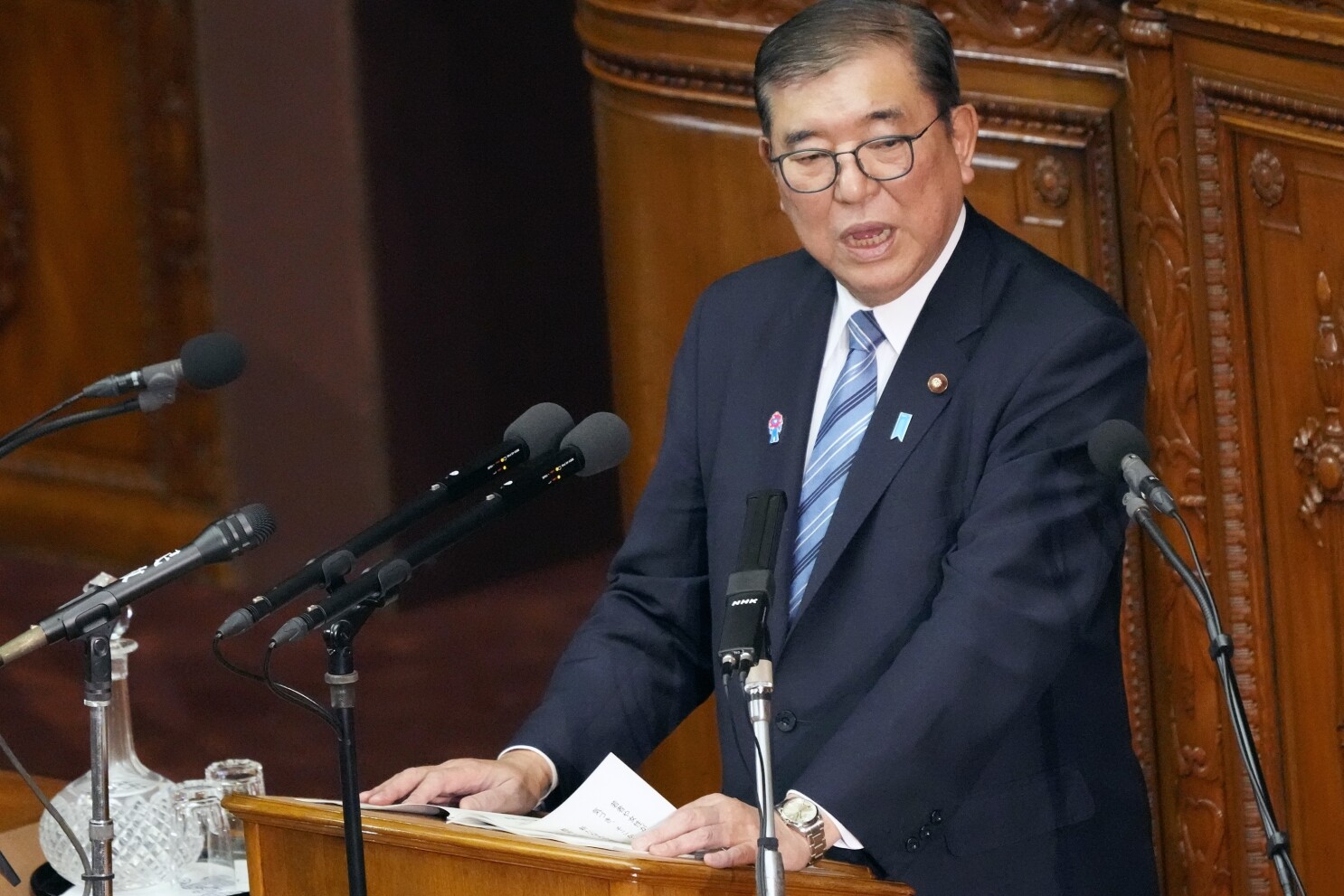 Japan's leader says he's preparing for tough negotiations with Trump on maintaining US presence