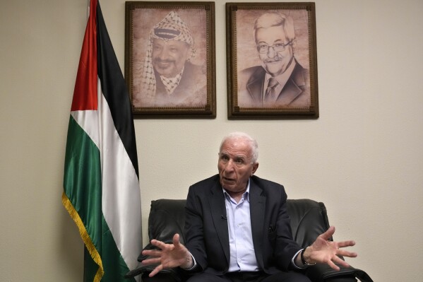 Azzam Al-Ahmad, a member of Fatah's central committee and of the Executive Committee of the Palestine Liberation Organization, speaks during an interview with the Associated Press at the Palestinian embassy, in Beirut, Lebanon, Sunday, Sept. 17, 2023. Al-Ahmad who traveled to Lebanon this month to attempt to end the fighting in the Ein el-Hilweh camp, said that Palestinian and Lebanese officials have given militant Islamist groups in Lebanon's largest Palestinian refugee camp until the end of the month to hand over the accused killers of a Fatah general. (AP Photo/Hussein Malla)