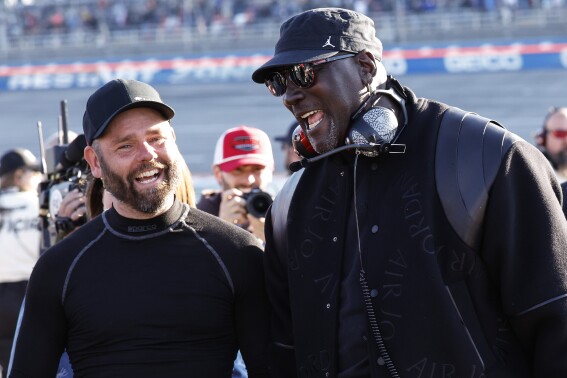 23XI Racing co-owner Michael Jordan celebrates a win by his driver Tyler Reddick after a NASCAR Cup Series auto race at Talladega Superspeedway, Sunday, April 21, 2024, in Talladega. Ala. (AP Photo/Butch Dill)