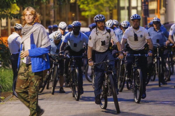 Police stand by as protestors prepare to leave a pro-Palestinian encampment at Drexel University early Thursday, May 23, 2004 in Philadelphia. (Alejandro A. Alvarez/The Philadelphia Inquirer via AP)