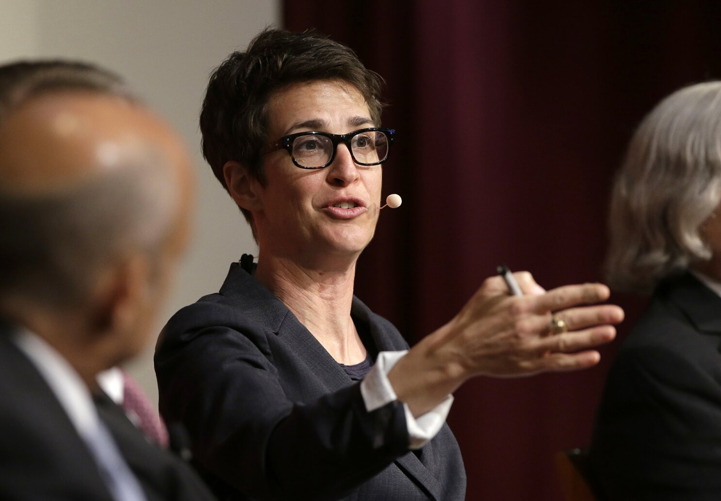 One America News sues Rachel Maddow for $10 million | AP News