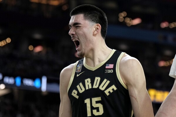 Purdue center Zach Edey celebrates after blocking a shot against UConn during the first half of the NCAA college Final Four championship basketball game, Monday, April 8, 2024, in Glendale, Ariz. (AP Photo/Brynn Anderson)