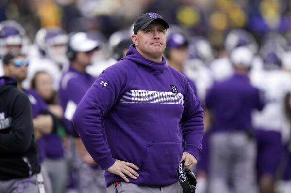 FILE - Northwestern head coach Pat Fitzgerald stands on the sideline during the first half of an NCAA college football game against Michigan, Oct. 23, 2021, in Ann Arbor, Mich. A judge Tuesday, April 2, 2024, denied Northwestern's motion to dismiss former coach Fitzgerald's $130 million lawsuit against the school claiming he was wrongly fired in the wake of a hazing scandal. (AP Photo/Carlos Osorio, File)