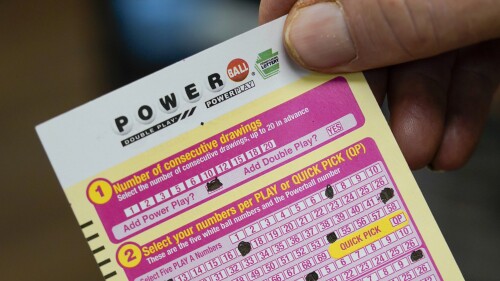 FILE - A person shows their scan card for their personal selection numbers for a ticket for a Powerball drawing on Nov. 7, 2022, at a convenience store in Renfrew, Pa. A winning ticket has been sold in California for Wednesday's drawing on July 19, 2023, for the Powerball jackpot worth $1 billion. (AP Photo/Keith Srakocic, File)