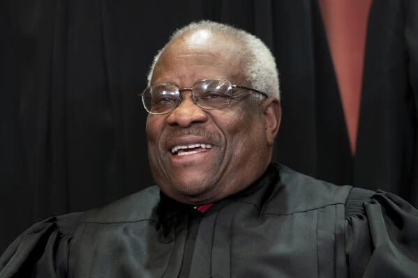 FILE - In this Nov. 30, 2018 photo, Supreme Court Associate Justice Clarence Thomas sits for a group portrait at the Supreme Court Building in Washington. Justice Thomas participated at a "fireside" chat in Salt Lake City hosted by former Sen. Orrin Hatch's foundation, Friday, March 11, 2022. (AP Photo/J. Scott Applewhite, File)