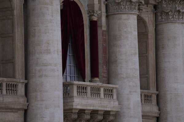 A view of the central balcony of St Peter's Basilica, at the Vatican, Wednesday, May 7, 2025. (AP Photo/Gregorio Borgia)