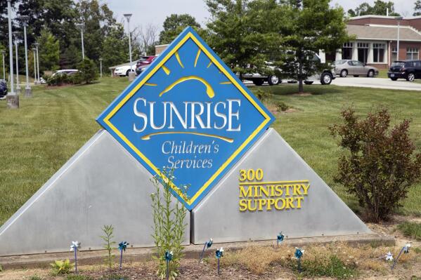 FILE - In this May 26, 2021 file photo, A sign for Sunrise Children's Services sits in front of the agency in Mount Washington, Ky. Kentucky reached a contract deal Thursday, July 15, 2021 to continue placing youngsters with a Baptist-affiliated children’s agency, coming after the Democratic governor's administration removed LGBTQ anti-discrimination language that the agency steadfastly refused to sign (Brandon Porter/Kentucky Today via AP, File)