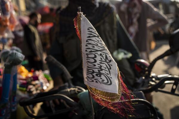 A Taliban flag is placed in the front of a motorbike in Kabul, Afghanistan, Tuesday, Sept. 28, 2021. (AP Photo/Bernat Armangue)