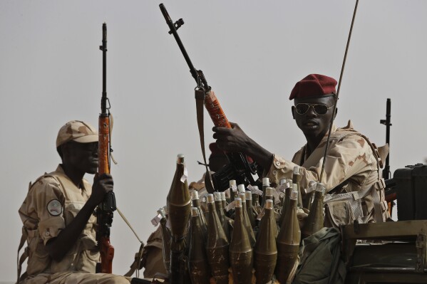 FILE - Sudanese soldiers from the Rapid Support Forces unit, led by Gen. Mohammed Hamdan Dagalo, the deputy head of the military council, secure the area where Dagalo attends a military-backed tribe's rally, in the East Nile province, Sudan, on June 22, 2019. The RSF, attacked the South Hospital in al-Fasher, the capital city of North Darfur province on Sunday, June 9, 2024 opening fire on medical staff and patients, Doctors Without Borders said in a statement. (AP Photo/Hussein Malla, File)