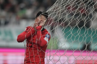 South Korea's Son Heung-min reacts after missing a scoring chance during the second round of the Asian qualifier group C match for 2026 World Cup between South Korea and Singapore at Seoul World Cup Stadium in Seoul, South Korea, Thursday, Nov. 16, 2023. (AP Photo/Lee Jin-man)