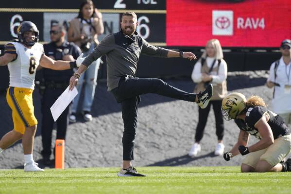 Colorado interim head coach Mike Sanford signals for a field goal with a kicking motion to the bench in the second half of an NCAA college football game against California at Folsom Field, Saturday, Oct. 15, 2022, in Boulder, Colo. (AP Photo/David Zalubowski)
