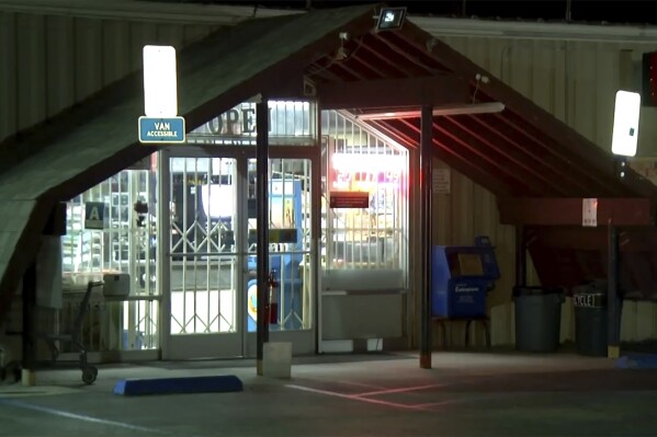 This image made from video provided by KBAK shows the exterior of Midway Market & Liquor in Frazier Park, California, on Oct. 12, 2023. A player in California won a $1.765 billion Powerball jackpot Wednesday night, ending a long stretch without a winner of the top prize. The winning ticket was sold at Midway Market & Liquor in Frazier Park, according to the California Lottery.(KBAK via AP)