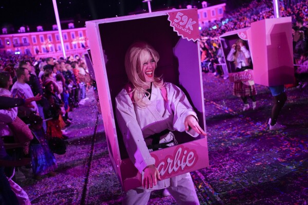 A dancer parades through Place Massena during the opening ceremony of 151st edition of the Nice Carnival in Nice, southern France, Saturday, Feb. 17, 2024. (AP Photo/Daniel Cole)