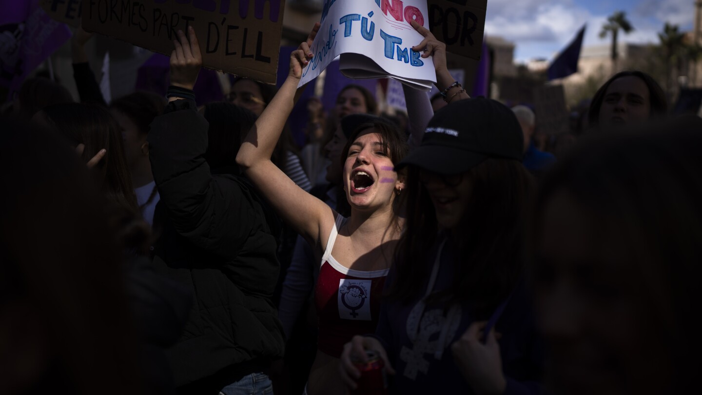 AP PHOTOS: Women mark International Women’s Day by taking part in efforts to combat discrimination
