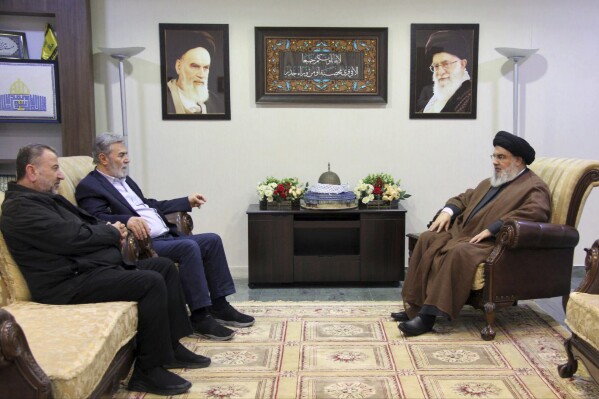 FILE - In this photo released on Oct. 25, 2023, by the Hezbollah Media Relations Office, Hezbollah leader Sayyed Hassan Nasrallah, right, meets with Ziad al-Nakhleh, the head of Palestinian Islamic Jihad, center, and Hamas deputy chief, Saleh al-Arouri, in Beirut. When the Lebanese militia Hezbollah announced last week that its leader Hassan Nasrallah would deliver his first public speech since the outbreak of the Israel-Hamas war, much of the region held its breath. (Hezbollah Media Relations Office, via AP, File)