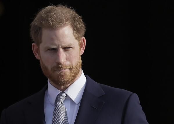 FILE - Britain's Prince Harry arrives in the gardens of Buckingham Palace in London, Thursday, Jan. 16, 2020.  (AP Photo/Kirsty Wigglesworth, File)