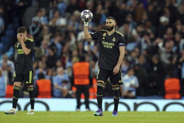 Real Madrid's Karim Benzema stands dejected during the UEFA Champions League semi-final second leg match against Manchester City at Etihad Stadium, Manchester. Man City beat Real Madrid 4-0 to advance to Champions League final. (Martin Rickett/PA via AP)