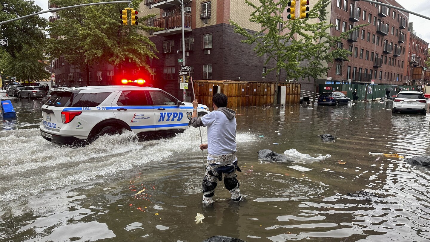 New York begins drying out after being stunned and soaked by record-breaking rainfall | AP News