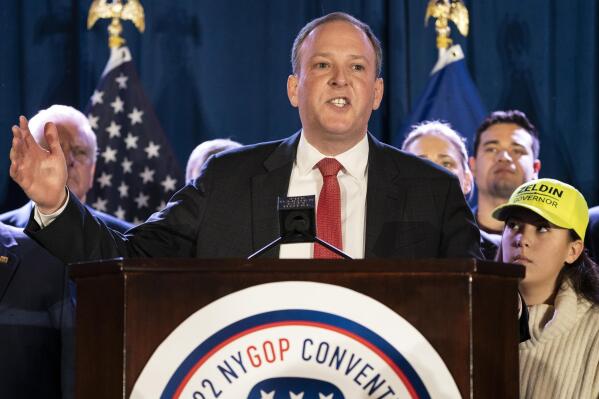 FILE - U.S. Rep. Lee Zeldin speaks to delegates and assembled party officials at the 2022 NYGOP Convention on March 1, 2022, in Garden City, N.Y. The Republican candidate for governor says his family is safe after two people were shot outside his Long Island home Sunday, Oct. 9. (AP Photo/John Minchillo, File)