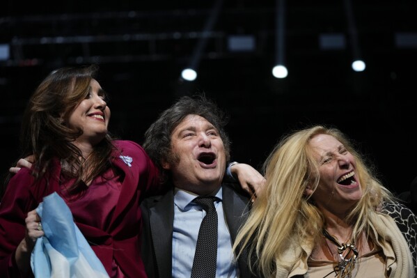 FILE- Presidential candidate Javier Milei, center, his sister Karina, right, and his running mate Victoria Villarruel hug during a campaign rally in Buenos Aires, Argentina, Oct. 18, 2023. Milei and Villarruel's ticket resoundingly won Argentina's presidency in the Nov. 19 runoff election. (AP Photo/Natacha Pisarenko, File)