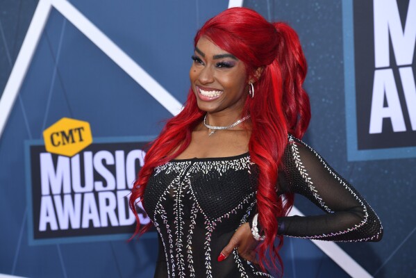 FILE – Reyna Roberts arrives at the CMT Music Awards, April 11, 2022, at the Municipal Auditorium in Nashville, Tennessee.  With the release of 