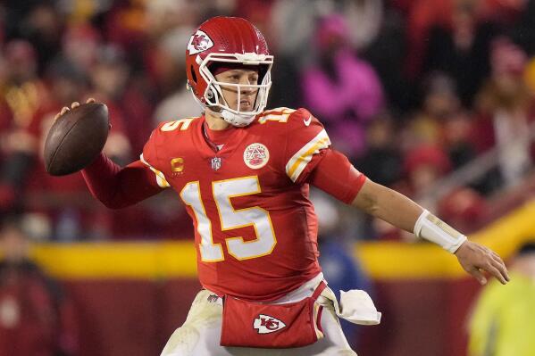 FILE - Kansas City Chiefs quarterback Patrick Mahomes looks to pass during the second half of an NFL divisional round playoff football game against the Jacksonville Jaguars, Saturday, Jan. 21, 2023, in Kansas City, Mo. Chiefs quarterback Patrick Mahomes plans to be ready for training camp with no limitations from the high ankle sprain that occurred during the playoffs and was such the focal point of their run to a Super Bowl victory in February. (AP Photo/Charlie Riedel, File)