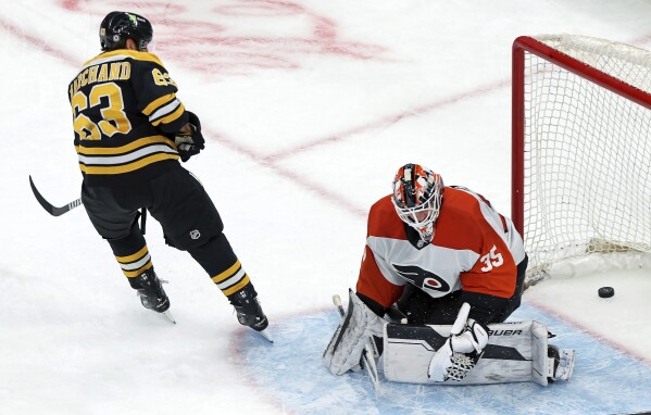 Flyers coach John Tortorella criticizes the officiating in a 4-3 overtime loss to the Bruins | AP News