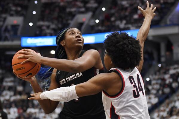 South Carolina's Aliyah Boston looks to shoot as UConn's Ayanna Patterson (34) defends in the second half of an NCAA college basketball game, Sunday, Feb. 5, 2023, in Hartford, Conn. (AP Photo/Jessica Hill)
