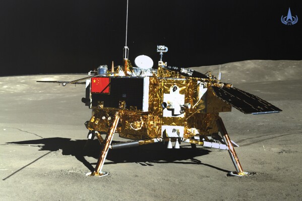 FILE - This photo provided on Jan. 12, 2019, by the China National Space Administration via Xinhua News Agency shows the lunar lander of the Chang'e-4 probe in a photo taken by the rover Yutu-2 on Jan. 11. China is preparing to launch a lunar probe Friday, May 3, 2024, that would land on the far side of the moon and return with samples that could provide insights into geological and other differences between the less-explored region and the better-known near side. (China National Space Administration/Xinhua News Agency via AP, File)