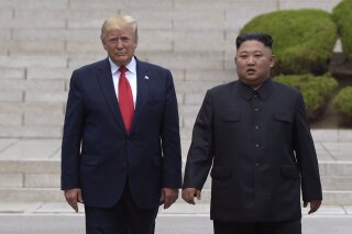 FILE- In this June 30, 2019, file photo, U.S. President Donald Trump, left, meets with North Korean leader Kim Jong Un at the North Korean side of the border at the village of Panmunjom in Demilitarized Zone.  North Korea's chief negotiator says discussions with the U.S. on Pyongyang's nuclear program have broken down, but Washington says the two sides had "good discussions" that it intends to build on in two weeks. The North Korean negotiator, Kim Miyong Gil, said Saturday, Oct. 5, talks in Stockholm broke down "entirely because the U.S. has not discarded its old stance and attitude."  (AP Photo/Susan Walsh, File)