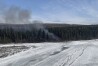 A fire burns after a Douglas C-54 Skymaster plane crashed into the Tanana River outside Fairbanks, Alaska, Tuesday, April 23, 2024. (Alaska State Troopers via AP)