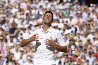 Serbia's Novak Djokovic celebrates after beating Australia's Nick Kyrgios to win the final of the men's singles on day fourteen of the Wimbledon tennis championships in London, Sunday, July 10, 2022. (AP Photo/Kirsty Wigglesworth)