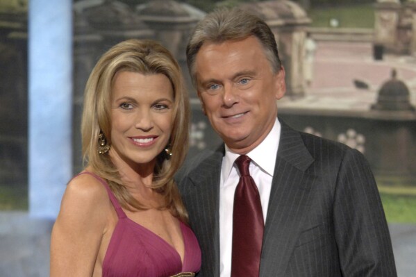FILE - Vanna White, left, and Pat Sajak make an appearance at Radio City Music Hall for a taping of celebrity week on "Wheel of Fortune" in New York on Sept. 29, 2007. (AP Photo/Peter Kramer, file)