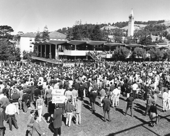 Scene on the university of California campus in Berkeley as a demonstration protesting U.S. presence in Vietnam started on Oct. 15, 1965. The spectators were entertained by folk. Singers and speeches. Later there was to be a march against the Oakland army terminal, seven miles away. Police refused to grant a parade permit, but the anti-Vietnam group leaders said they would march anyway. (AP Photo, File)