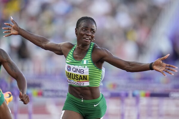 FILE - Tobi Amusan, of Nigeria, wins the women's 100-meter hurdles final at the World Athletics Championships on July 24, 2022, in Eugene, Ore. Amusan says she has been charged with a rules violation for missing three doping tests in the span of 12 months. The Nigerian posted the news on her Instagram account Tuesday, July 18, 2023, and said she would fight the charges. (AP Photo/Ashley Landis, File)