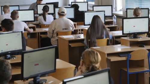 Students take the Ukrainian final state examination, a test after high school for those who hope to attend university, in Warsaw, Poland, Wednesday June 7, 2023. Russian forces have destroyed 262 educational institutions and damaged another 3,019 in their invasion of Ukraine, according to government figures. For those who've fled to other countries, schooling is suffering in unprecedented ways, according to families, educators, experts and advocates. The effects of war and relocation combined with the challenges of studying in a new country are compounding educational setbacks for young refugees. (AP Photo/Czarek Sokolowski)
