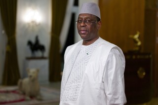 FILE - Senegal President Macky Sall poses before an interview with The Associated Press at the presidential palace in Dakar, Senegal, Feb. 9 , 2024. Senegal’s President Macky Sall said Thursday, Feb. 22, 2024, that he will end his term in April as expected, but he didn't give a new date for the presidential election originally scheduled for Sunday. (AP Photo/Sylvain Cherkaoui, File)