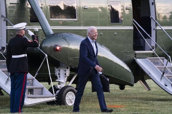 FILE - In this May 23, 2021 file photo, President Joe Biden smiles as he walks from Marine One upon arrival on the Ellipse at the White House, in Washington. President Biden will visit Tulsa next week to commemorate the 100th anniversary of the 1921 massacre that claimed up to hundreds of lives. The White House said Tuesday, May 25, 2021, that Biden will visit the city on June 1. His appearance follows a series of events that include a keynote speech from Stacey Abrams and concert from John Legend. (AP Photo/Alex Brandon File)