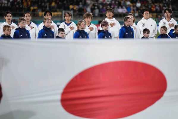 Japan's team listen to the national anthem before the Women's World Cup Group C soccer match between Japan and Spain in Wellington, New Zealand, Monday, July 31, 2023. (AP Photo/John Cowpland)
