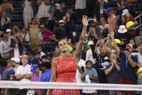 FILE -Aryna Sabalenka, of Belarus, waves to fans after defeating Maryna Zanevska, of Belgium, in the first round of the U.S. Open tennis championships, Tuesday, Aug. 29, 2023, in New York. Sabalenka was honored as an International Tennis Federation 2023 ITF World Champion on Thursday, Dec. 14, 2023, after being the only woman to reach at least the semifinals in singles at all four Grand Slam tournaments this season. (AP Photo/Jason DeCrow, File)