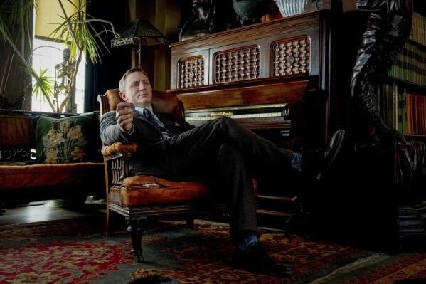 This image released by Lionsgate shows Daniel Craig in a scene from "Knives Out." Craig will return as Detective Benoit Blanc in “Glass Onion: A Knives Out Mystery,” writer-director Rian Johnson’s follow-up to his whodunit hit “Knives Out.” It will premiere at this year’s Toronto International Film Festival. (Claire Folger/Lionsgate via AP)