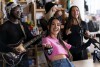Becky G motions to the crowd while performing during a taping for NPR's Tiny Desk concert series on Wednesday, Aug. 30, 2023, in Washington. (AP Photo/Stephanie Scarbrough)