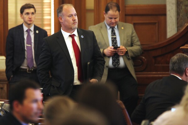 Kansas House Taxation Committee Chair Adam Smith, R-Weskan, watches the House debate leading to the rejection of a plan for cutting taxes, Thursday, April 4, 2024, at the Statehouse in Topeka, Kan. Smith had expected before the debate that the plan drafted by Republican leaders and Democratic Gov. Laura Kelly would fail. (AP Photo/John Hanna)