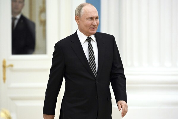 Russian President Vladimir Putin arrives to meet with the leaders of all the main religious denominations of Russia in the Catherine Hall of the Moscow Kremlin in Moscow, Russia, Wednesday, Oct. 25, 2023. (Sergei Guneyev, Sputnik, Kremlin Pool Photo via AP)