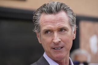 FILE - In this June 3, 2021 file photo California Gov. Gavin Newsom listens to questions during a news conference in San Francisco. Most of California's coronavirus rules governing public gatherings will disappear on Tuesday, June 15, 2021, after Newsom signed an executive order Friday afternoon that heralds the end of the pandemic's hold on much of public life for the nation's most populous state. (AP Photo/Eric Risberg, File)