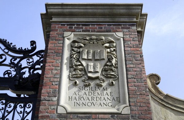 The relief sculpture is located on March 13, 2016 at the gate to the entrance to Harvard University in Cambridge, Massachusetts (AP Photo/Steven Senne, file)